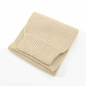 Detailed view of the beige knitted winter scarf, short collar design, soft and warm fabric.