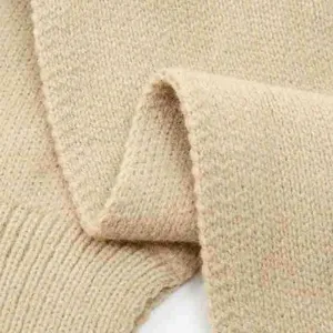 Detailed close-up view of the soft knitted fabric texture on the warm winter women neck warmer.