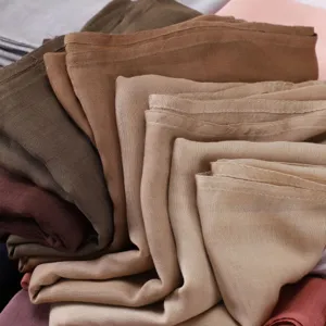 Close up detail of soft modal breathable solid color scarf fabric texture and rich color options.