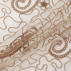 Detailed close-up of sheer nylon fabric featuring elegant brown embroidered scroll patterns.