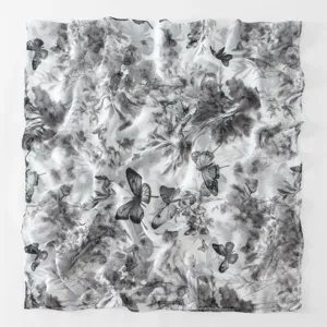 Close-up detail of the black and white floral butterfly print soft voile scarf shawl.