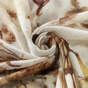 Soft lightweight voile printed scarf detail, elegant brown floral pattern shawl for women.