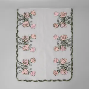 Embroidery rose pattern mesh scarf detail, lightweight sheer floral shawl fabric close up.