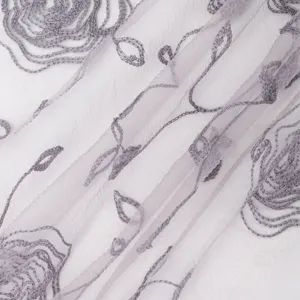 Close-up detail of sheer mesh nylon scarf featuring delicate grey floral embroidery texture.