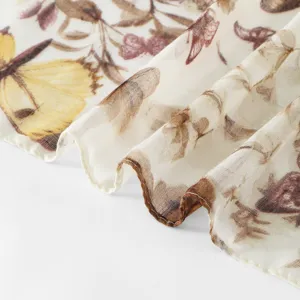 Detailed shot of a lightweight floral butterfly printed scarf for women, soft and elegant.