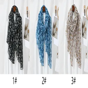 Detail view of floral print lightweight long scarf variant, soft breathable fabric styling.
