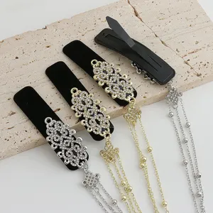 Exquisite new Chinese style rhinestone hair clip with metallic tassel chain, detailed view.