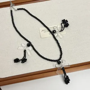 Collana di perle nere gotica Y2K con fiocchi in acrilico trasparente, gioielli stile punk dolce.