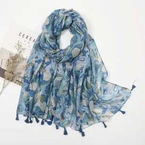 Women's blue botanical leaf print linen-feel scarf with chic tassel fringe, spring summer travel.