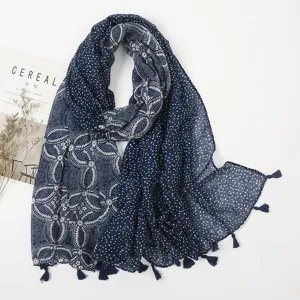 Navy blue polka dot ethnic scarf with tassels, detailed fabric display for women fashion.