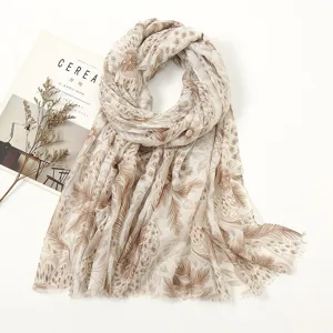 Detailed view of beige floral print scarf, soft cotton linen blend, elegant spring wrap.