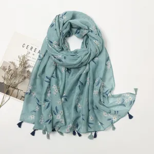 Floral print scarf detail view, lightweight literary fabric with delicate tassels for summer.
