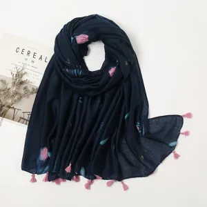 Detailed view of dark blue floral scarf with pink tassels, soft fabric for women daily wear.