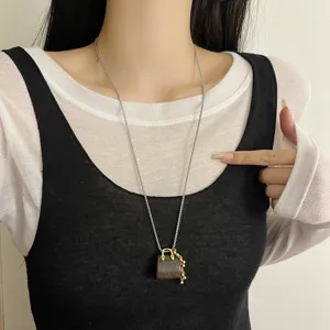 Chic natural tiger eye stone mini handbag pendant long sweater chain necklace with golden beads.