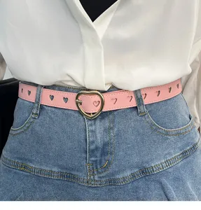 Pink leather belt detail with heart cutouts and gold heart buckle for women trousers fashion.
