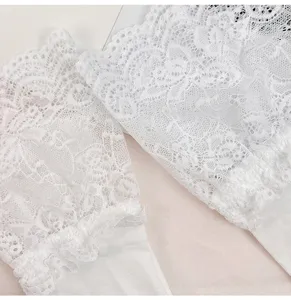 Detail view of white lace ruffles over-the-knee socks, Lolita JK ballet style long tube socks.