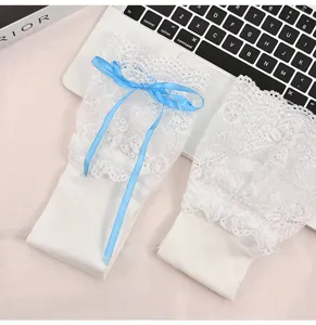 White lolita lace over-the-knee socks with cute blue ribbon bows for sweet JK style outfits.