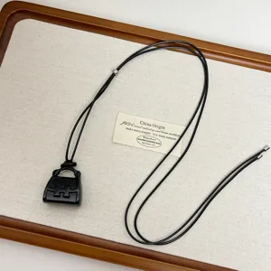 Black bag pendant necklace minimalist long sweater chain chic unique jewelry accessory style