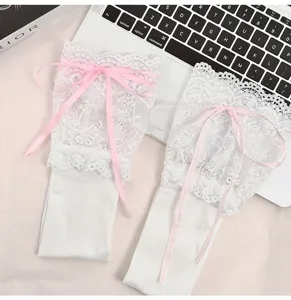 Detailed shot of white Lolita lace over-the-knee socks featuring sweet pink ribbon bows.