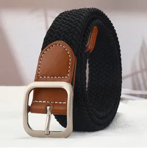 Close-up detail of black woven elastic belt with brown leather tab and silver square buckle.