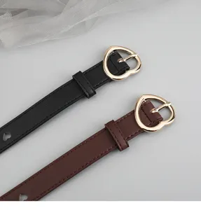 Women fashion thin leather belt with gold heart buckle, stylish casual waist strap for jeans.