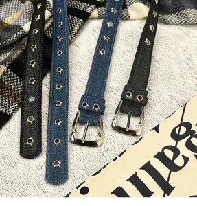 Close-up details of denim pin buckle belts featuring unique star metal stud decorations.