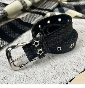 Black denim belt for women with star eyelets and metal pin buckle stylish jeans accessory.