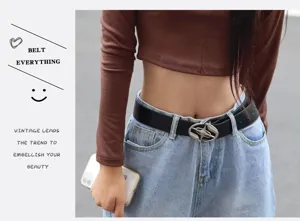 Stylish black leather belt with unique metal buckle for women and men, perfect jeans accessory.