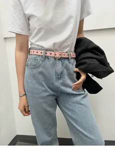 Details of the pink heart cutout leather belt with a cute metallic buckle for women outfits.