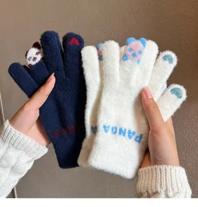 Close-up detail of winter warm knit touch screen gloves featuring cute cartoon panda patterns.