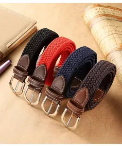 Detailed shot of elastic braided canvas belt with leather ends and metal buckle.