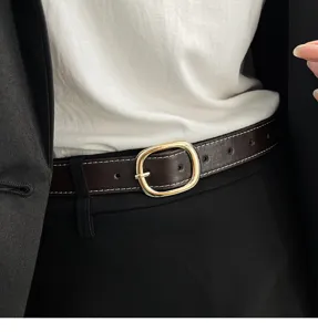 Women's stylish brown leather belt with gold buckle and white stitching for jeans and pants.