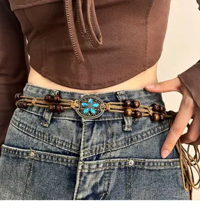 Bohemian woven waist chain with wooden beads and vintage blue crystal flower metal buckle detail.
