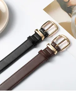Women casual leather belt detail showing black and brown straps with gold metal pin buckles.