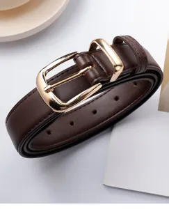 Detailed shot of a stylish brown women leather belt featuring a sleek gold-tone metal buckle.