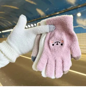 Detail view of cute winter warm touch-screen gloves with soft plush embroidered animal face design.