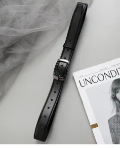 Classic black leather belt detail showcasing silver metal buckle and minimalist style.