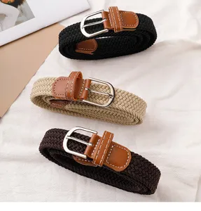 Detailed close-up view of casual woven elastic belts featuring stylish leather trim and metal buckles.