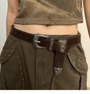 Detailed close-up shot of the retro brown western leather belt with ornate silver buckle.