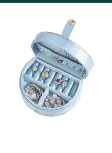 Portable velvet jewelry box with ring slots, necklace hooks, and multi-functional storage.