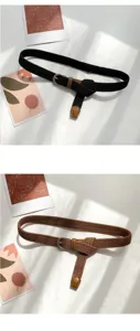 Detail shot of retro woven elastic canvas belt with metal buckle, casual style for jeans.