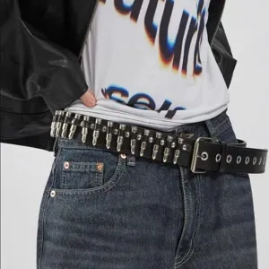 Punk black PU leather belt with metal bullet rivets, stylish Y2K waist accessory for jeans.