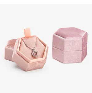 Detailed view of the pink velvet hexagonal jewelry box, featuring soft interior lining.