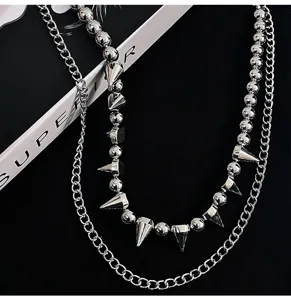 Punk style double layer silver pant chain with beads and metal spikes, cool streetwear accessory.