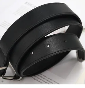 Detailed close-up view of a classic black leather women belt with metal buckle for daily wear.
