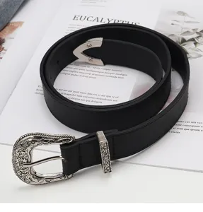 Vintage western style black leather belt with ornate engraved silver metal buckle detail.