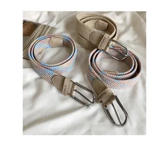 Women's woven elastic belt with pin buckle, versatile braided strap for jeans and dresses.