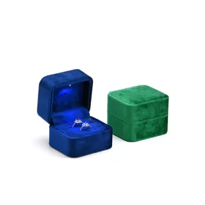 Luxury square velvet ring box with LED spotlight for jewelry storage and gift display.