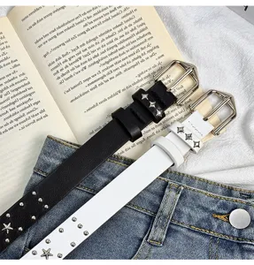 Y2K punk style star stud leather belt detail, double prong buckle waist accessory.