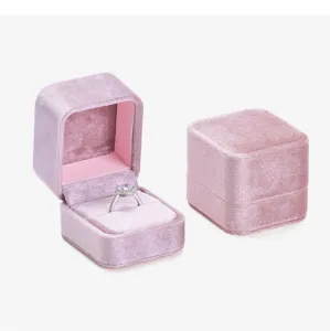 Detailed view of pink velvet ring box, elegant design for proposal, engagement and jewelry storage.